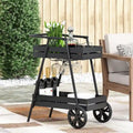 Carrello bar industriale moderno con struttura in ferro, design ispirato alla carriola, portabottiglie e ruote piroettanti